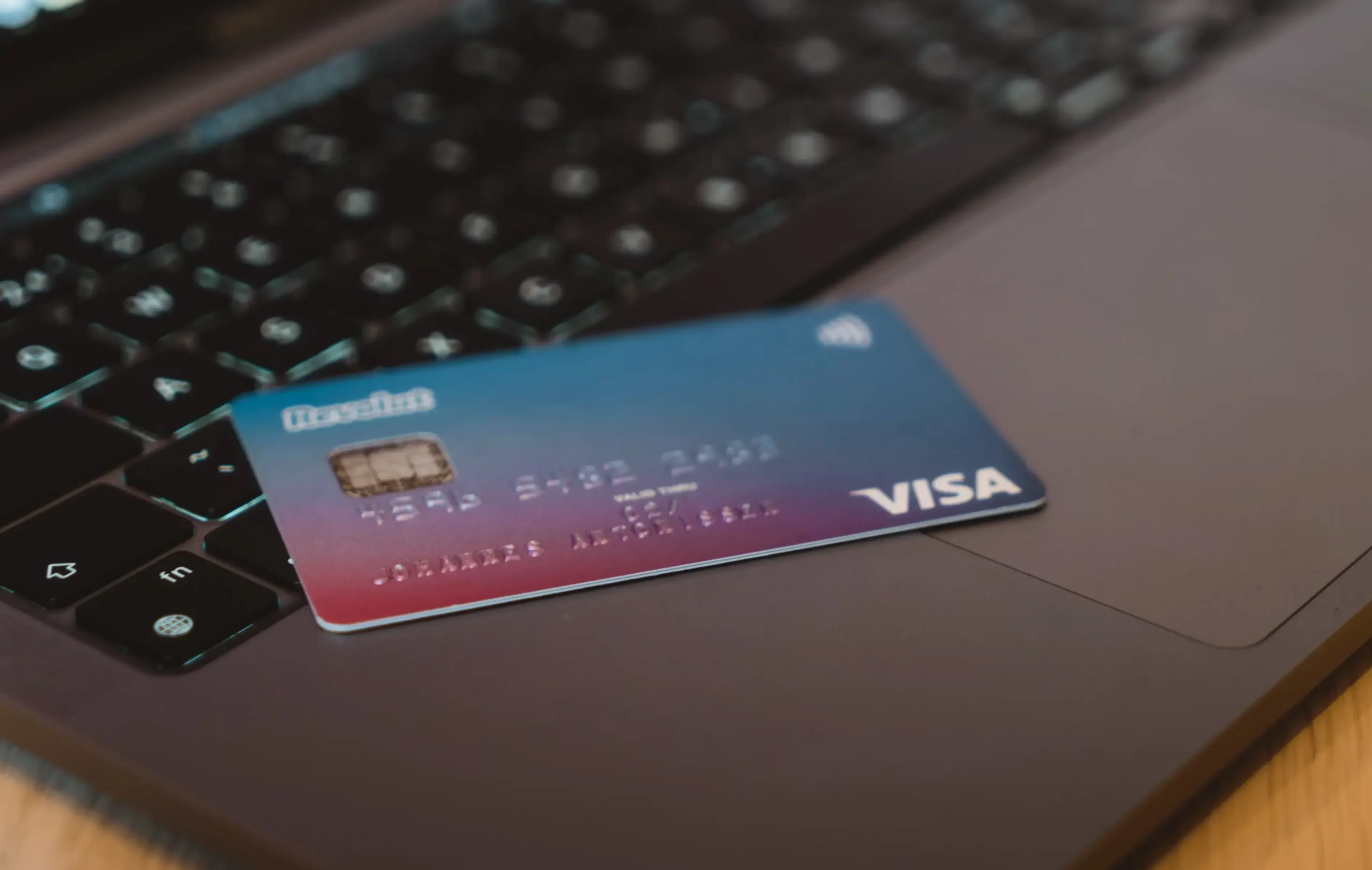 visa card placed on a laptop